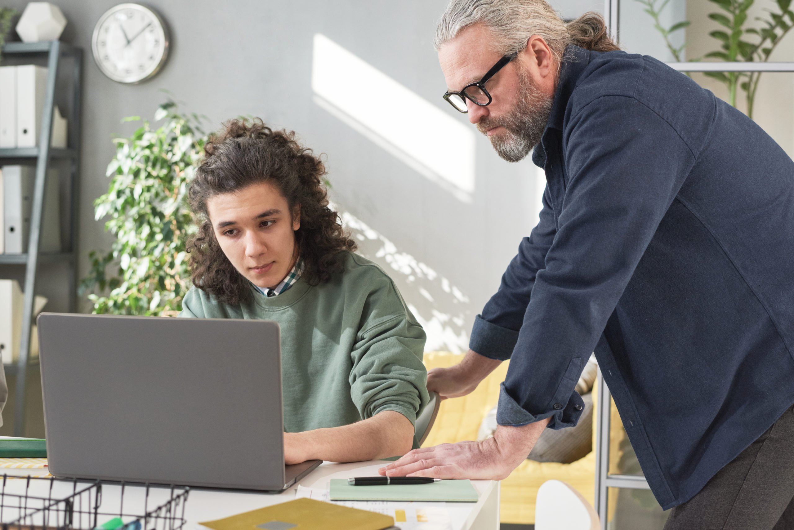 Teacher working with student